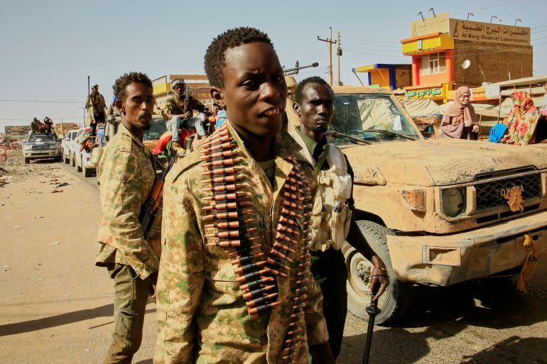FILE - Soldiers arrive to the Allafah market, in an area recently recaptured by Sudan's army from the Rapid Support Forces paramilitary group, in the Al Kalalah district, south of Khartoum, Sudan, March 27, 2025. (AP Photo, File)