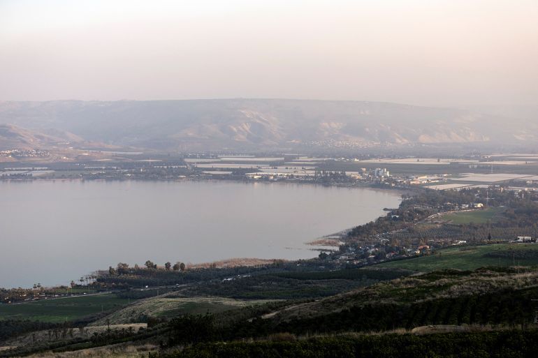A general view shows the Sea of Galilee with Jordan in the background