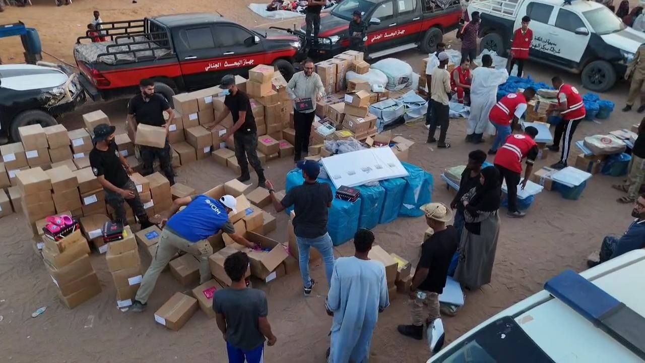 May be an image of 8 people, car, crowd and text