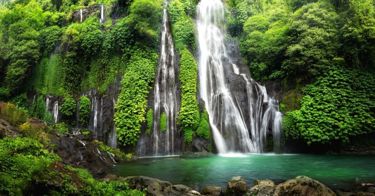 Aerial drone view of beautiful Aling Aling waterfall in nothern Bali, Indonesia; Shutterstock ID 1125344219; purchase_order: ajnet; job: ; client: ; other: بالي