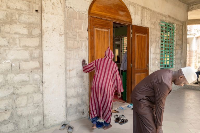 Worshippers enter the Great Mosque of Nietty Mbar in Thiaroye, a suburb of Dakar, Senegal, where Imam Ibrahima Diane, advocate for an end to gender-based violence and practices like female genital mutilation, officiate, Friday, July 4, 2025.(AP Photo/Sylvain Cherkaoui)