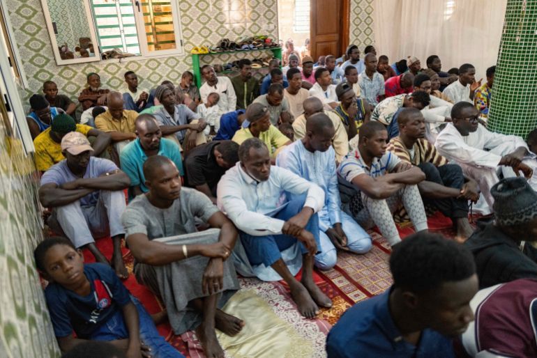Worshippers listen to Imam Ibrahima Diane, advocate for an end to gender-based violence and practices like female genital mutilation, deliver his sermon at the Great Mosque of Nietty Mbar in Thiaroye, a suburb of Dakar, Senegal, Friday, July 4, 2025.(AP Photo/Sylvain Cherkaoui)